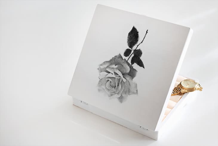DIY jewelry box featuring a rose illustration on the front