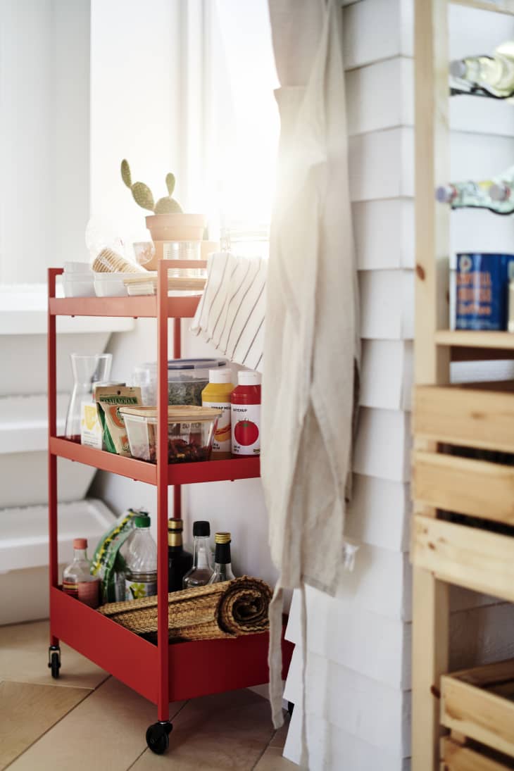 Red rolling cart in kitchen