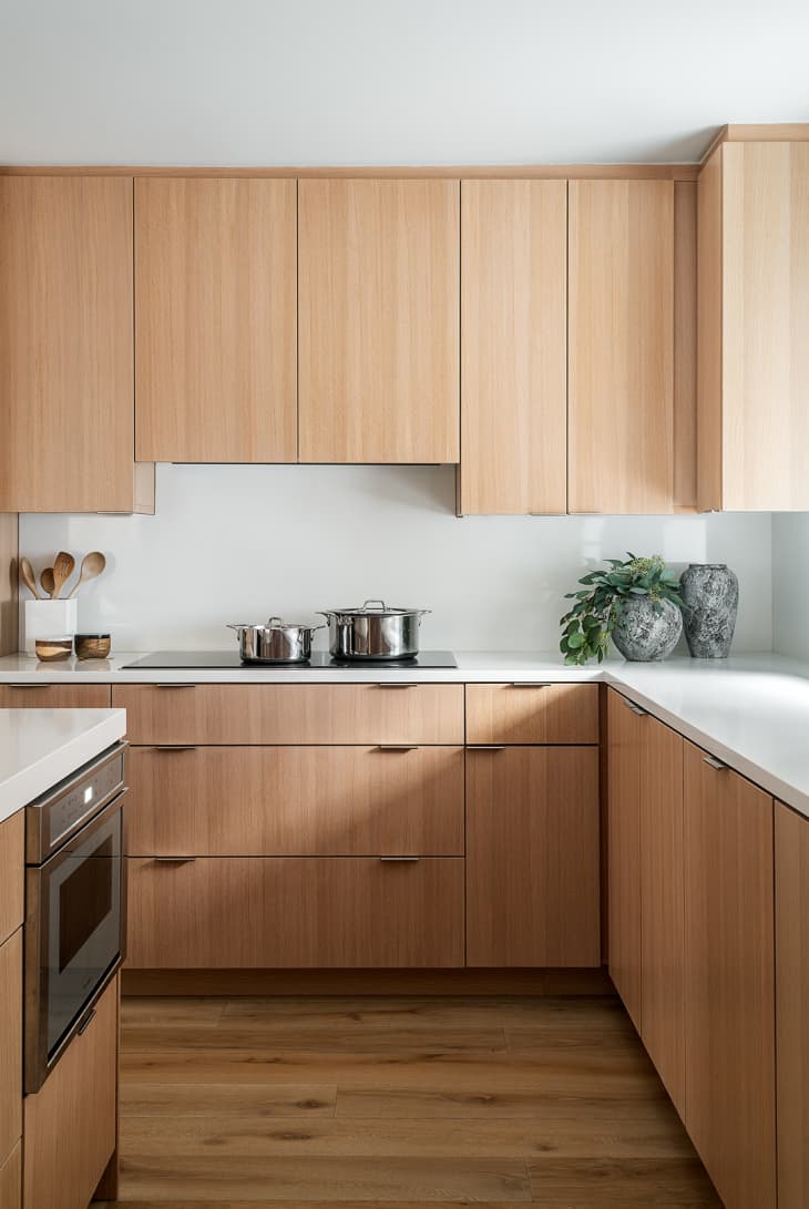 Bright kitchen with neutral wood cabinetry.