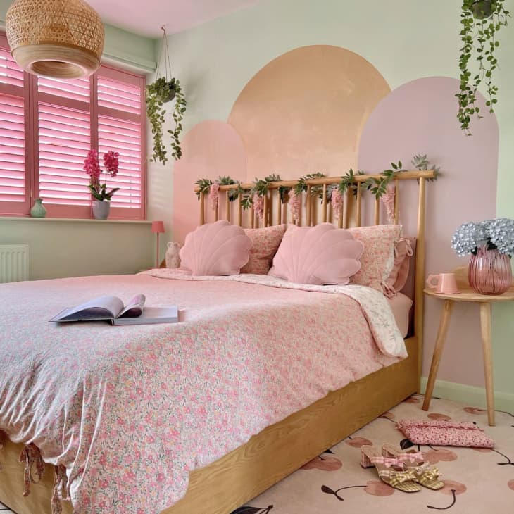 bright pink window blinds against a pastel bedroom