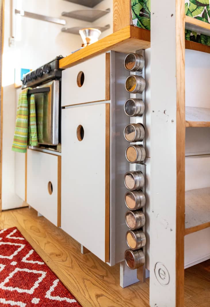 a magnetic spice cabinet in a tiny house kitchen