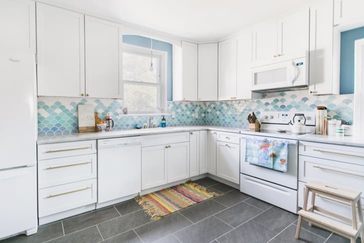 blue and white backsplash and a white kitchen