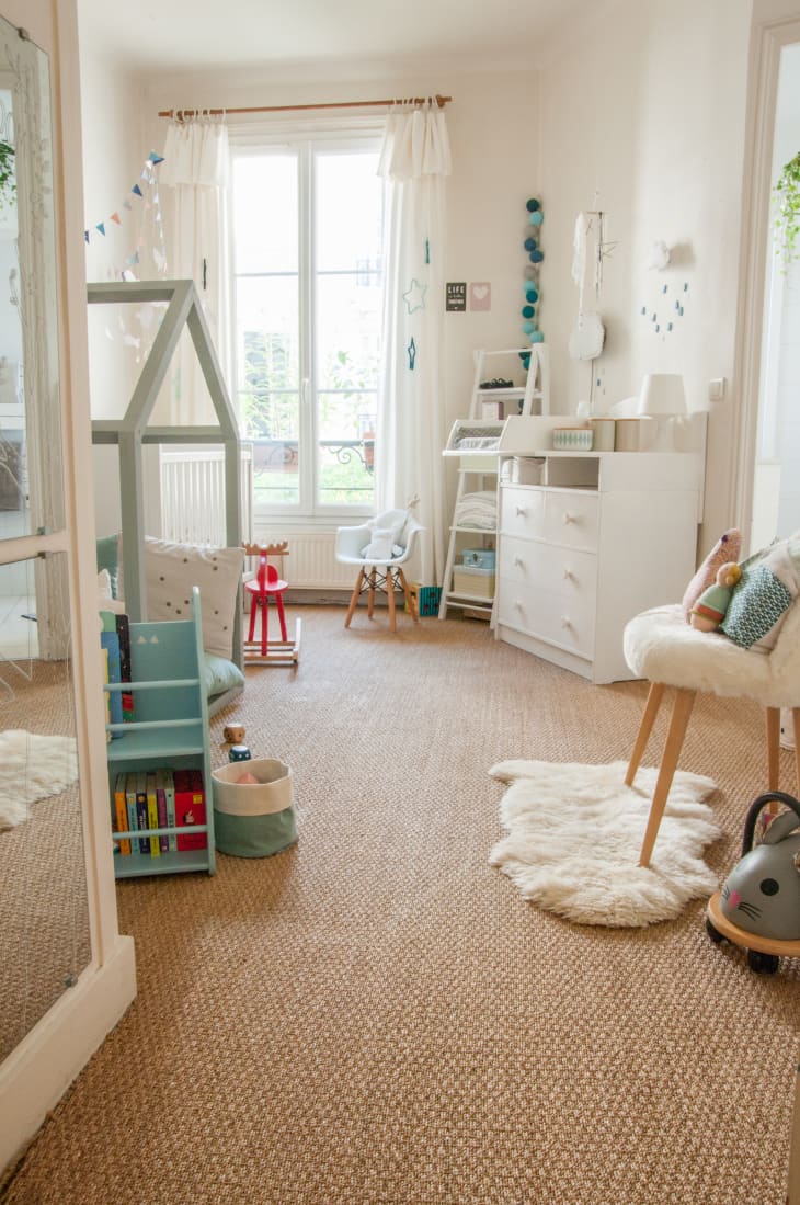 Parisian nursery with white walls and colorful accents