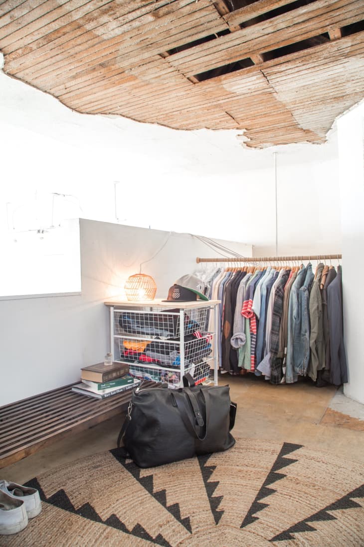 a rack full of clothing sits just a few feet off the ground