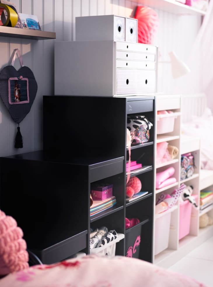 IKEA's Trofast unit combines bin storage with open shelving and uses two colors to make it practical and artistic