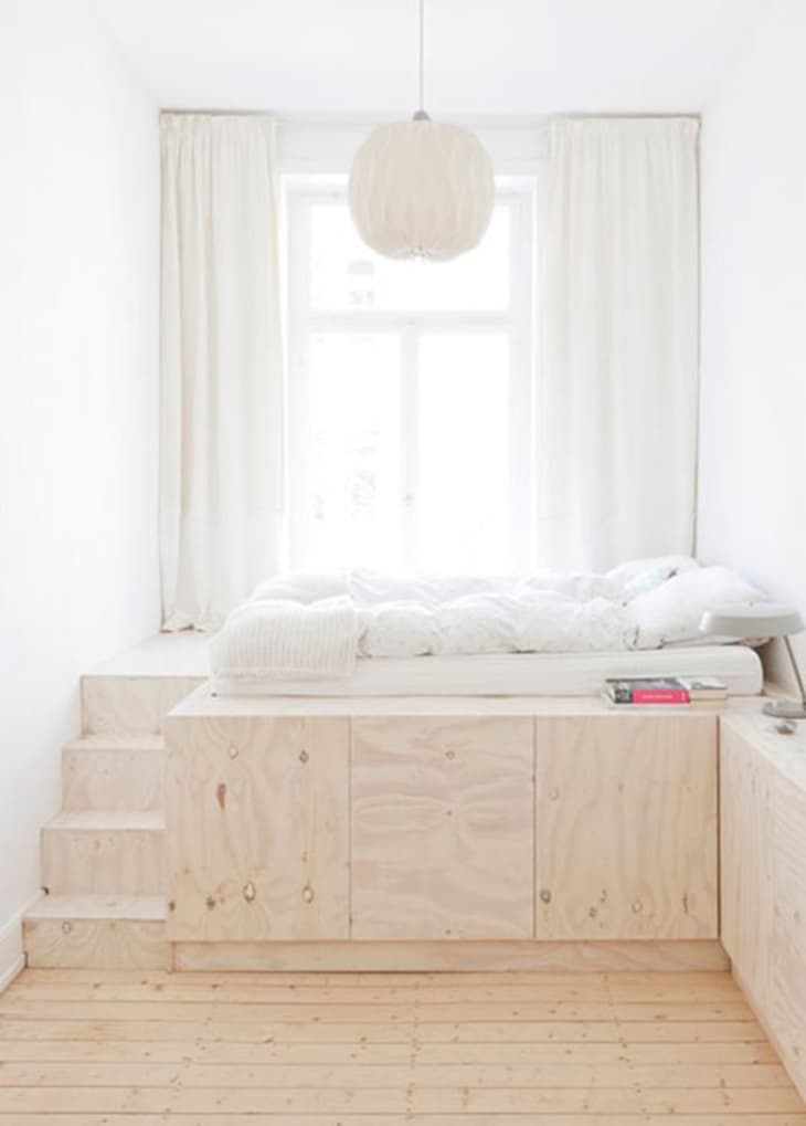 wooden levels divider in minimalist bedroom.