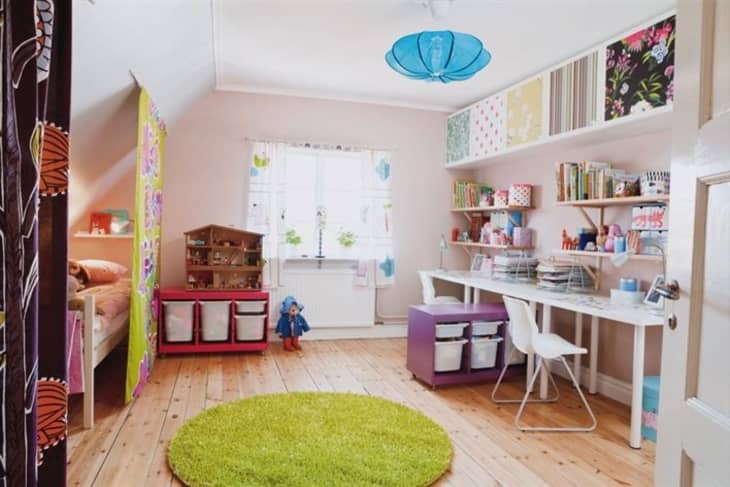 A light-filled and colorful kid's room shows Trofast units, where toys are neatly stored