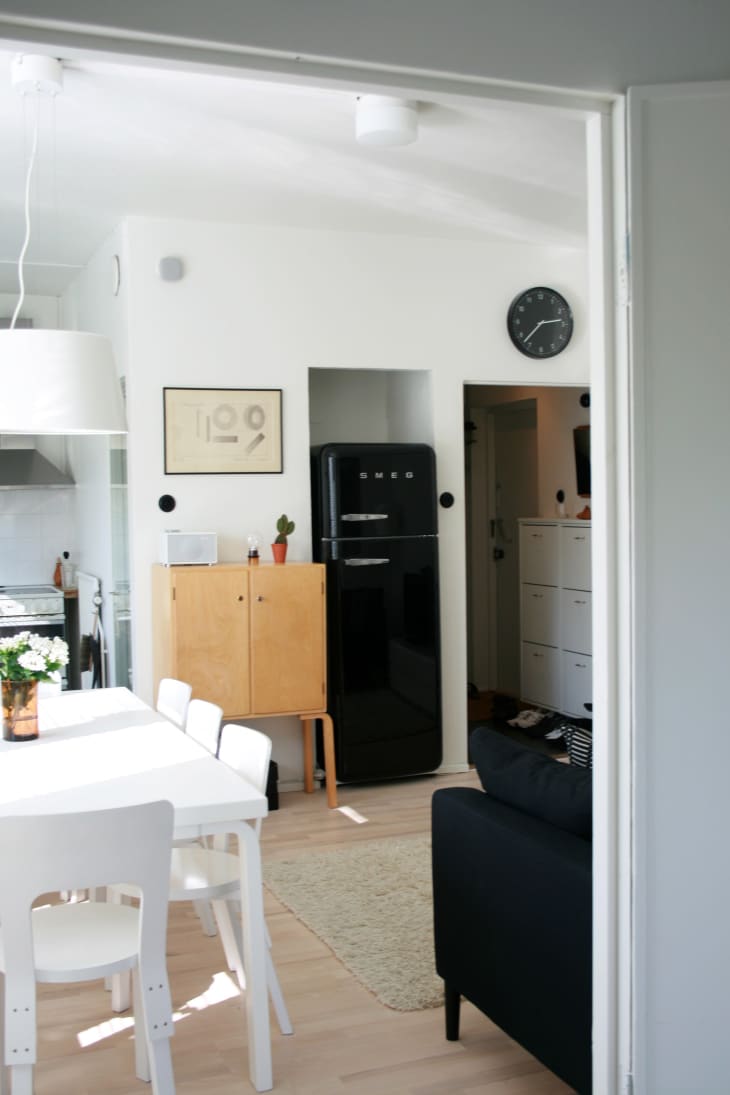 Small kitchen with black SMEG fridge