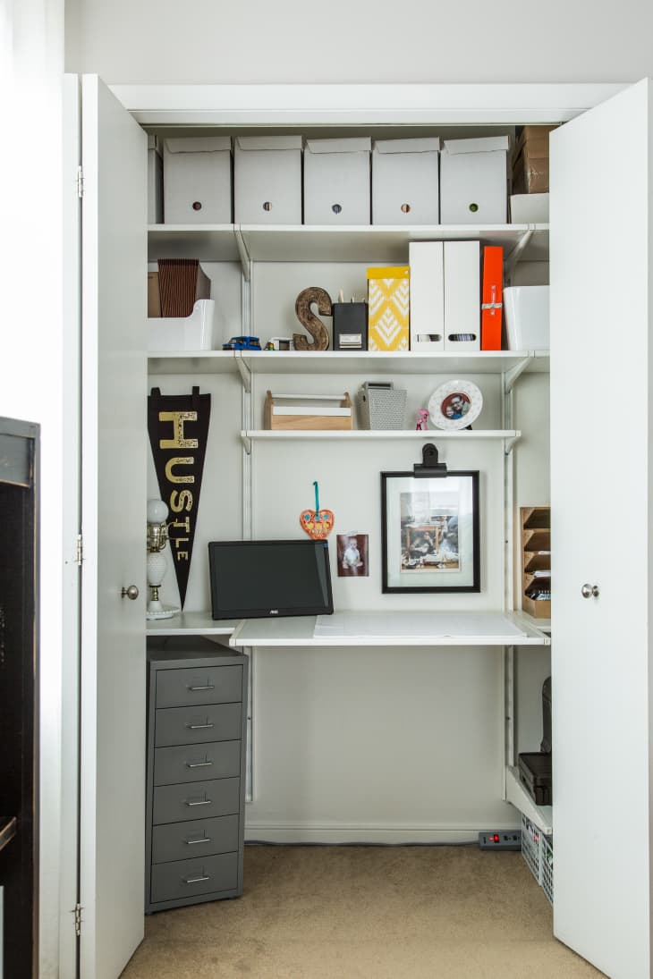 a wall-mounted shelf system inserted into a closet