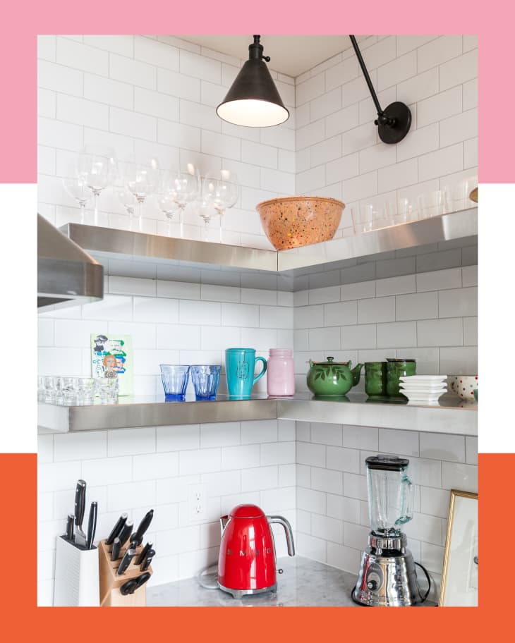 Kitchen corner with stainless steel shelving and colorful ceramics
