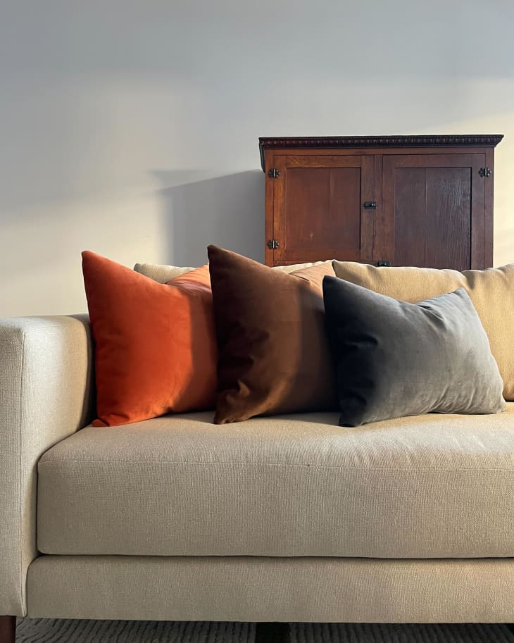 Detail of sofa with 3 velvet Sabai square lumbar pillows