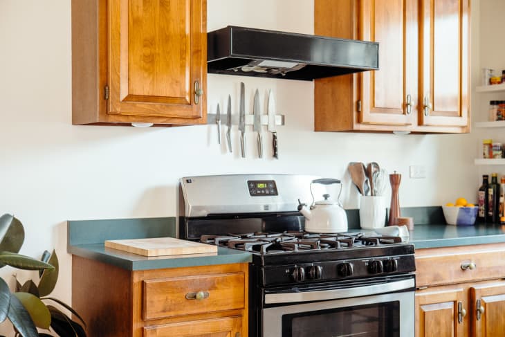 kitchen with wood cabinets and black oven stovetop