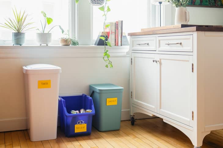 Trash station in the kitchen with trash can, recycling bin, and compost bin