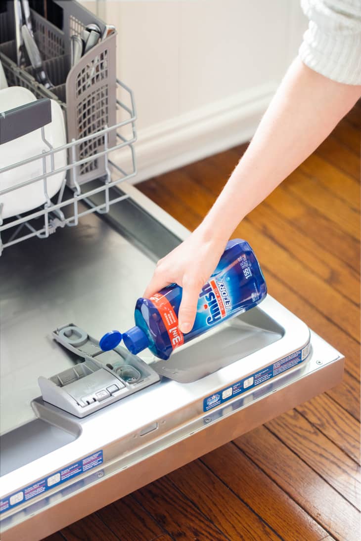 putting rinse aid into dishwasher