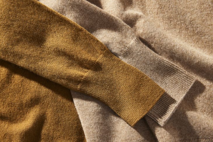 Closeup photo of 2 cashmere sweater sleeves, each a different brown tone