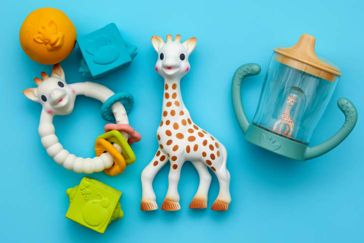 Sophie the Giraffe products on blue surface