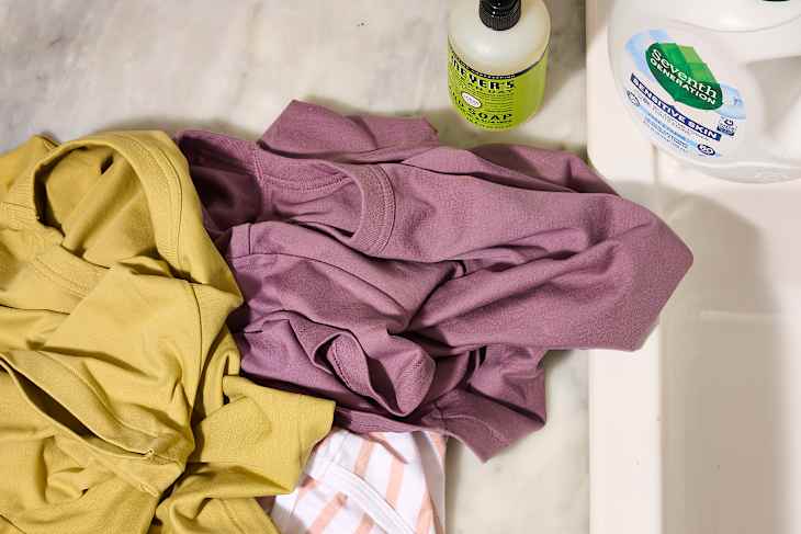 overhead shot of a pile of clothes on a counter before being washed