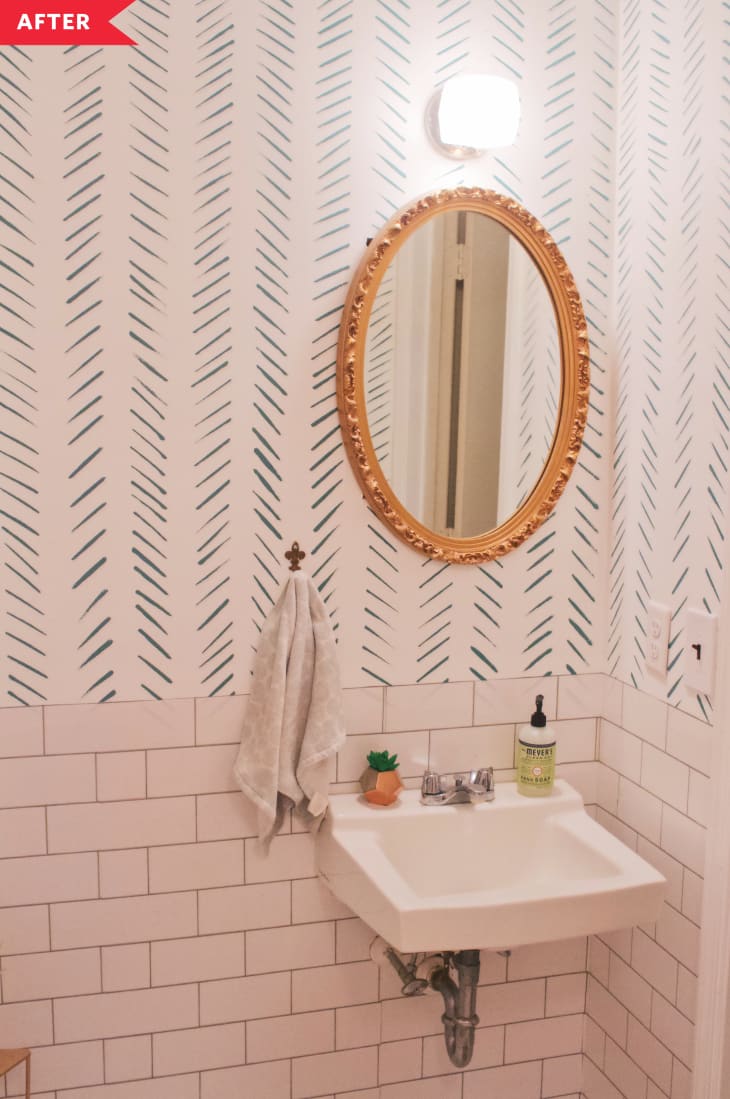 After: Bathroom with chevron walls, faux subway tile, and a gold mirror
