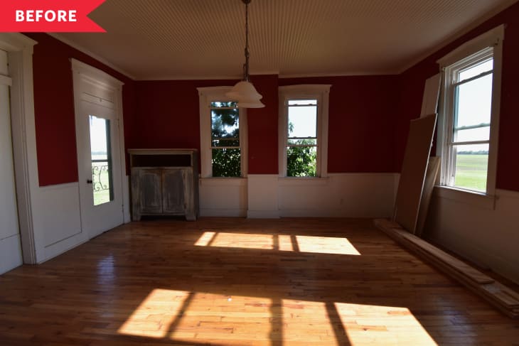 Before: Dark living room with red walls and white beadboard