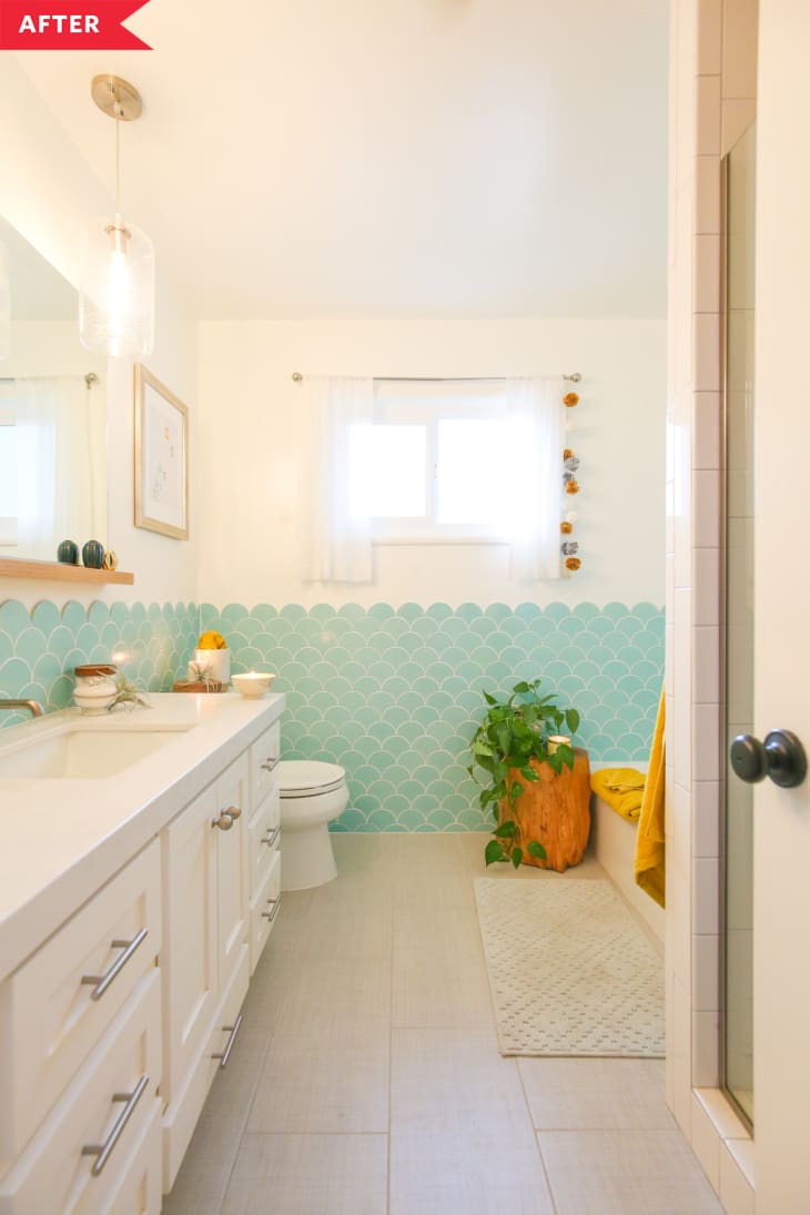 After: White bathroom with light blue scalloped wall tile