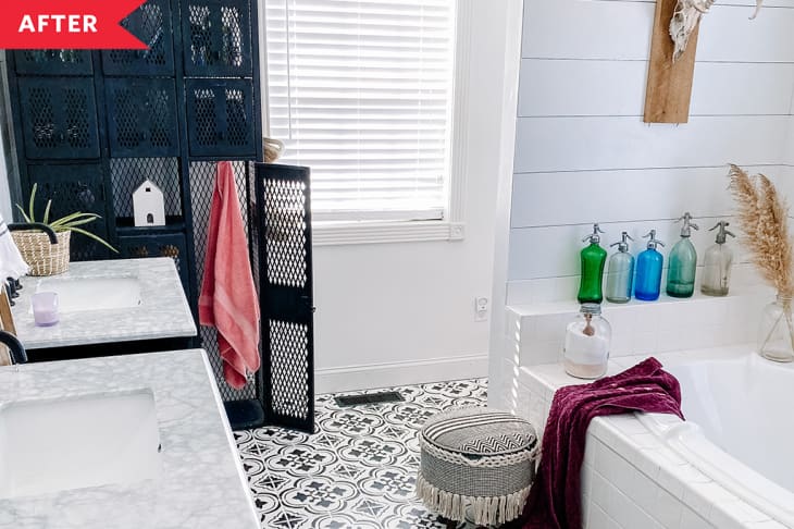 After: Bathroom with patterned tile floors, shiplap walls, and a white tub