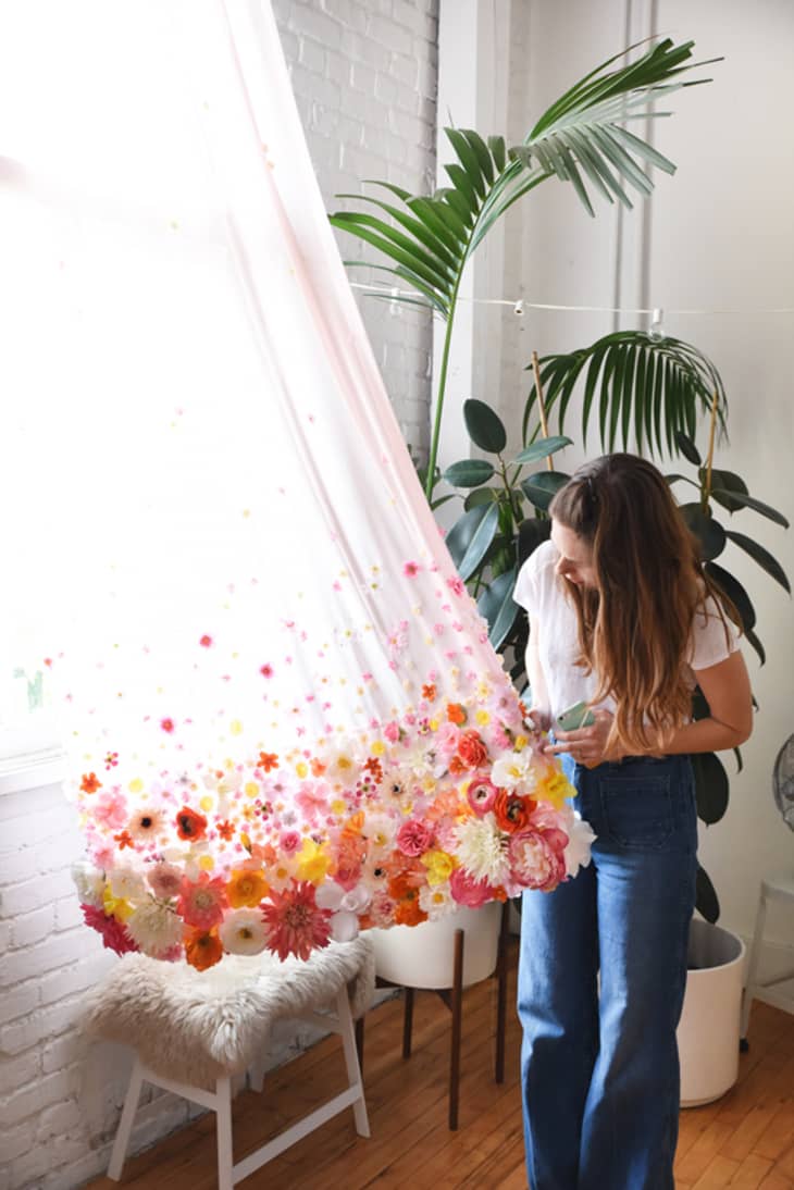 Sheer curtain with faux flowers at the bottom edge