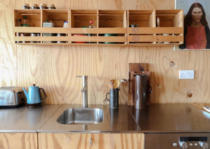 Kitchen with plywood-covered cabinets