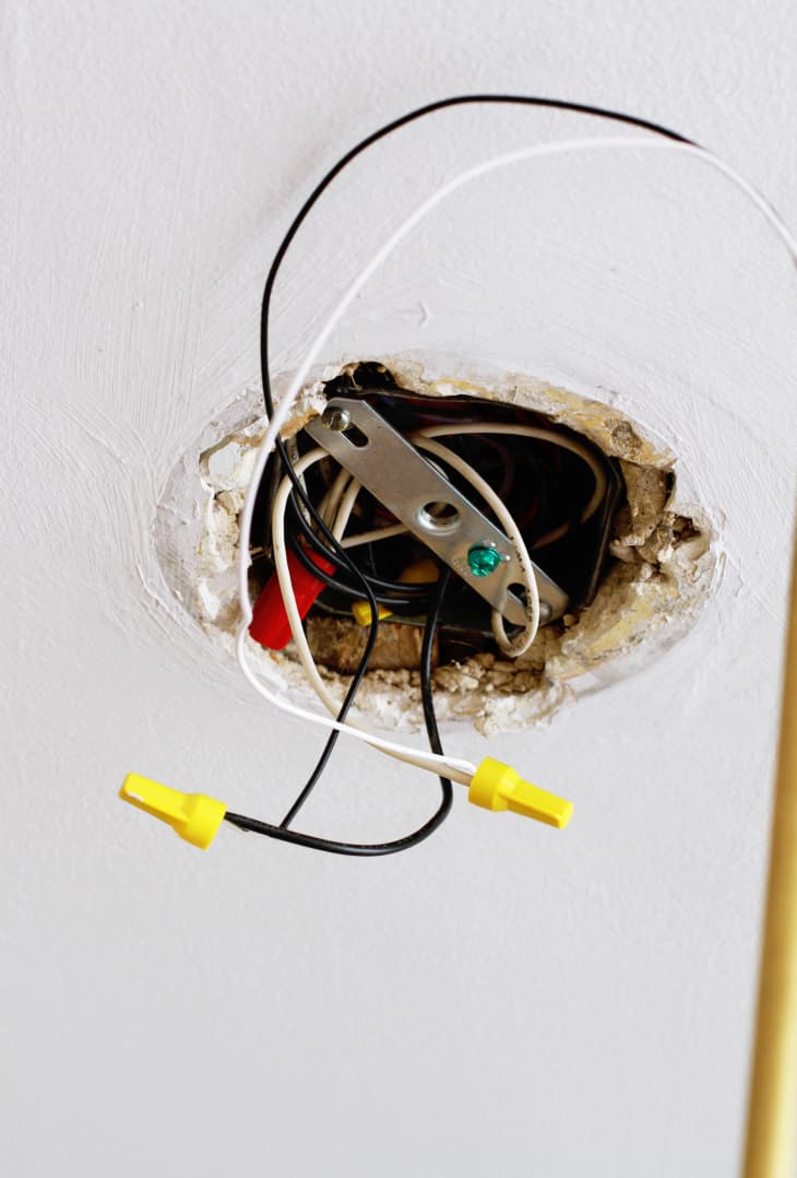 electrical box with wires attached to wires from ceiling light; now protected by connectors