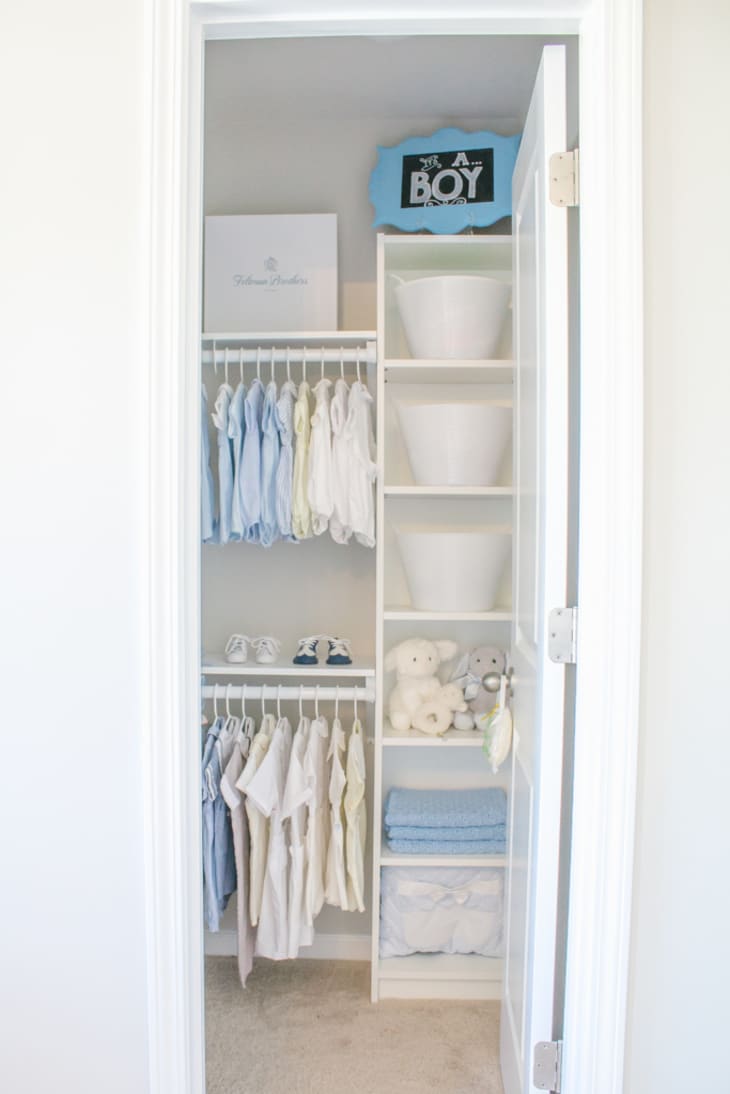 small closet with IKEA BILLY bookshelf and hanging rods