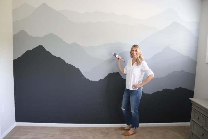 painted wall featuring mountain range in shades of gray