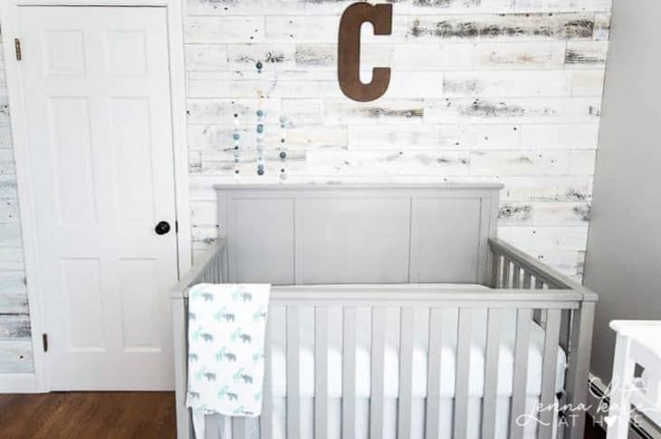 nursery with whitewashed reclaimed wood accent wall
