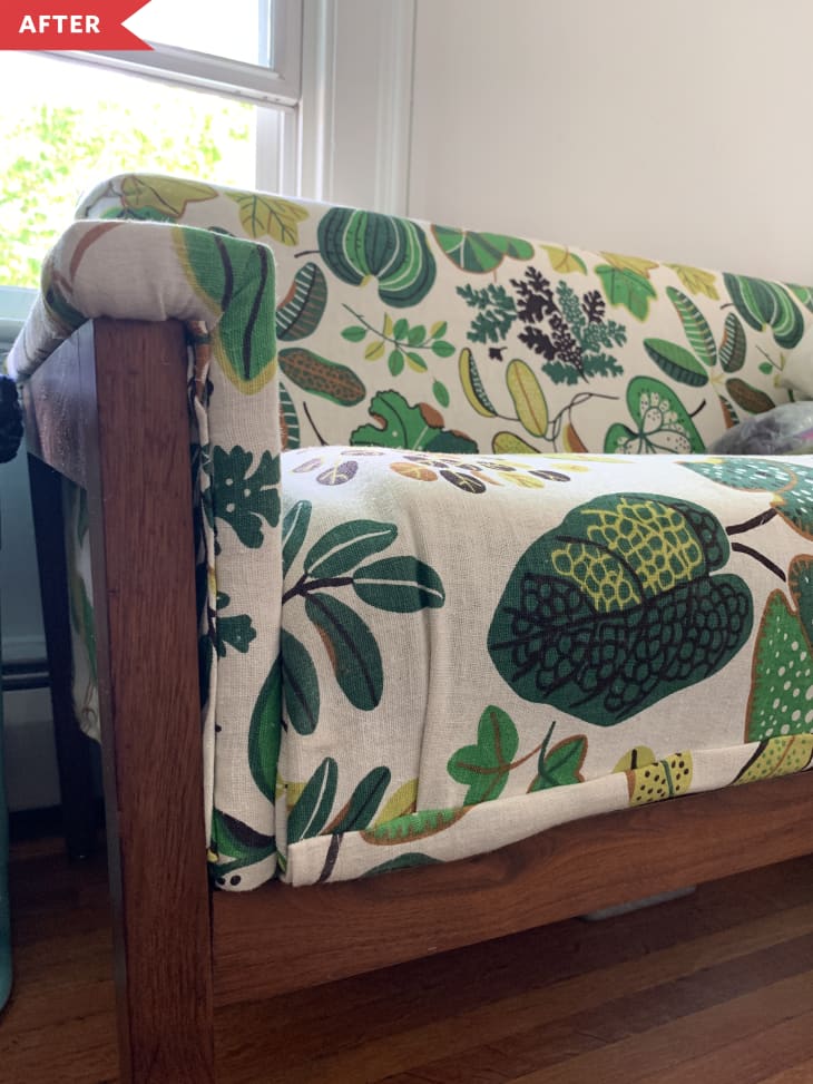 After: mid-century sofa with leafy fabric covering., close-up