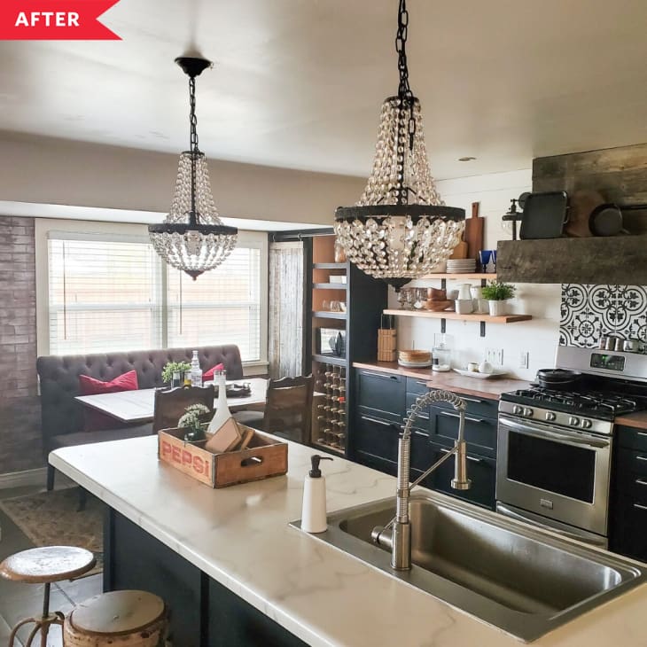 After: Kitchen with black base cabinets, open shelving, and glass beaded chandeliers