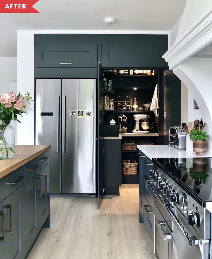 After: Kitchen with dark green lower cabinets, open shelving, and bright white walls