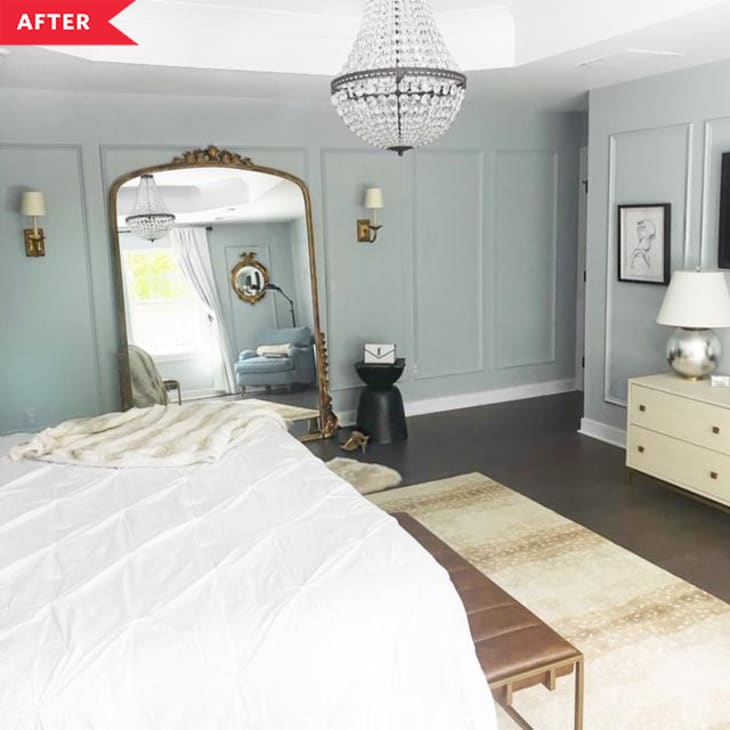 After: gray-blue bedroom with picture frame molding, hardwood floors, and giant floor mirror