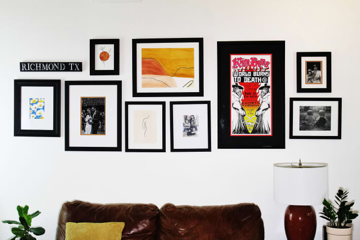 gallery wall with matching black frames and white mats