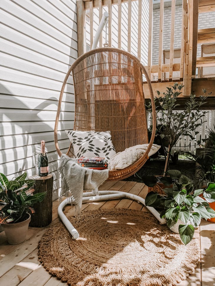 swinging chair surrounded by plants