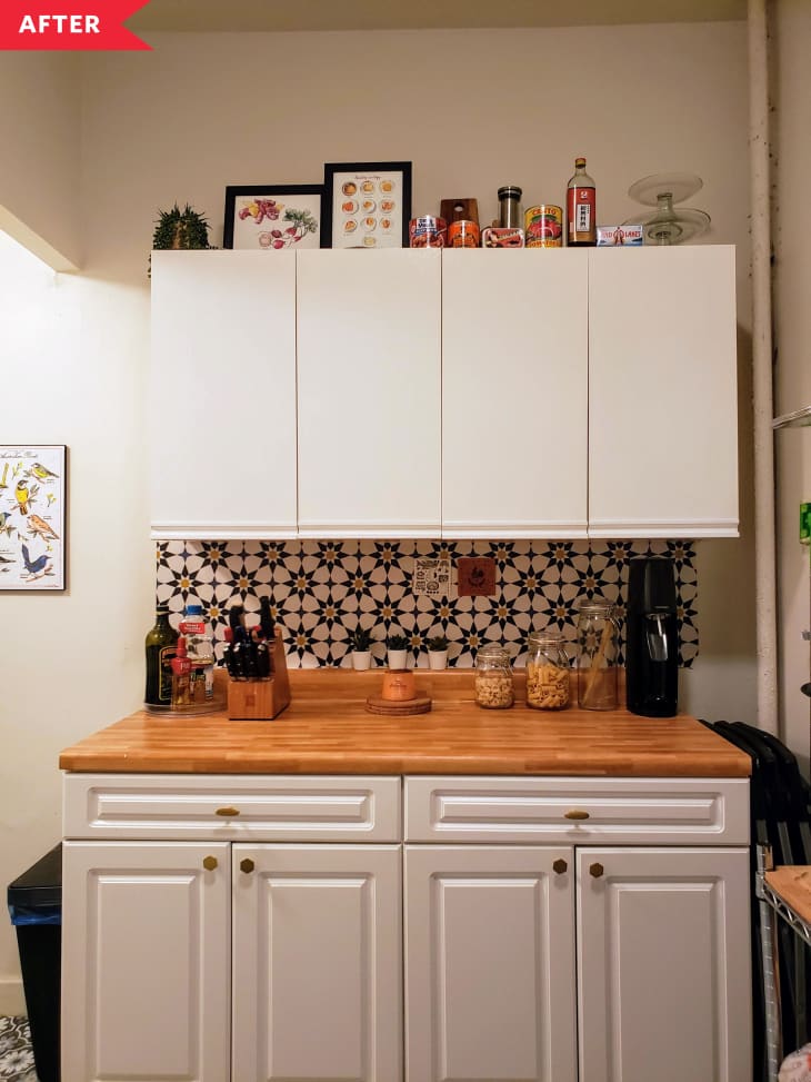 After: Kitchen with white cabinets, patterned floor, patterned backsplash, and wood-look counter