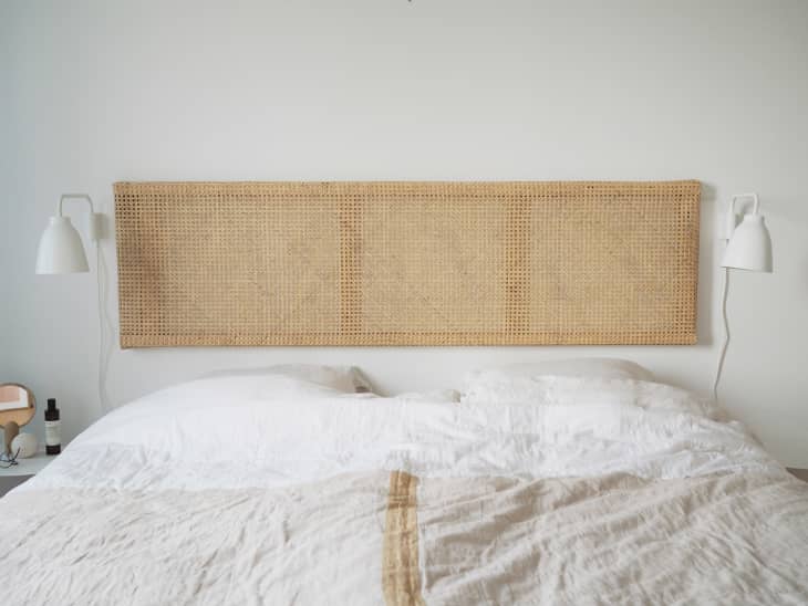 bed with floating caned headboard
