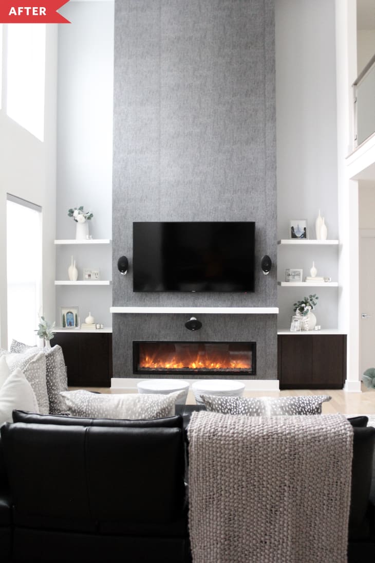 After: Living room with gray fireplace and open shelves