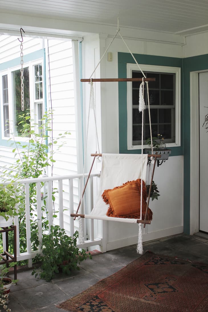 DIY hanging chair mounted on a covered porch
