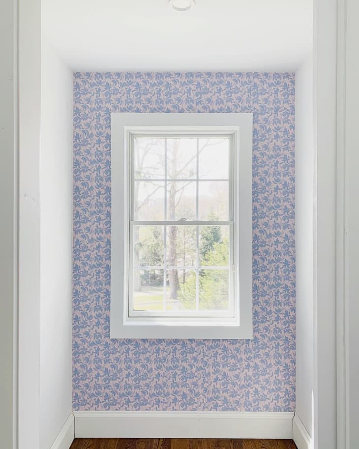 wallpapered closet wall with window