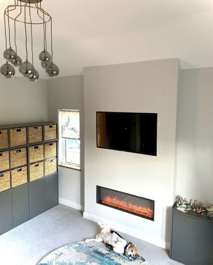 Living room with tall gray cabinets made from IKEA EKET cabinet boxes