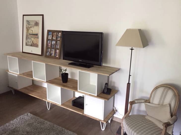 tv stand made with EKET boxes propped on long wood boards
