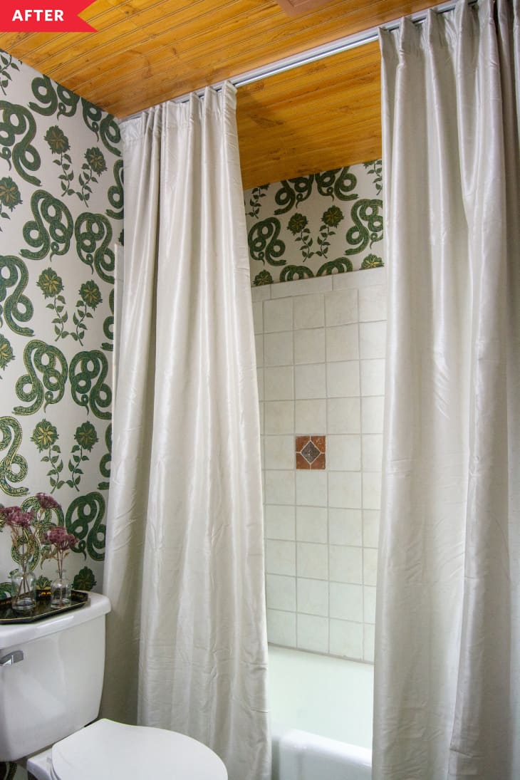 After: bathroom with snake wallpaper and wood ceiling