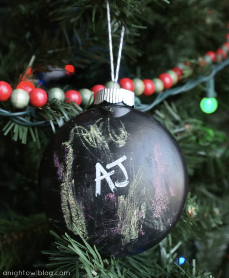 "AJ" written on chalkboard paint-covered ornament