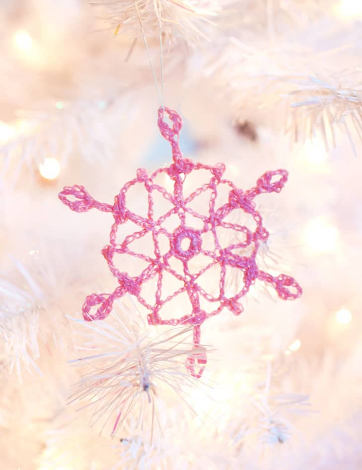 Delicate pink crocheted snowflake ornament