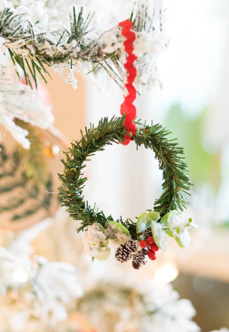 Small wreath ornament on red string