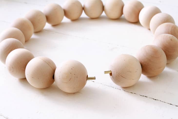 Adding wood beads to metal tube