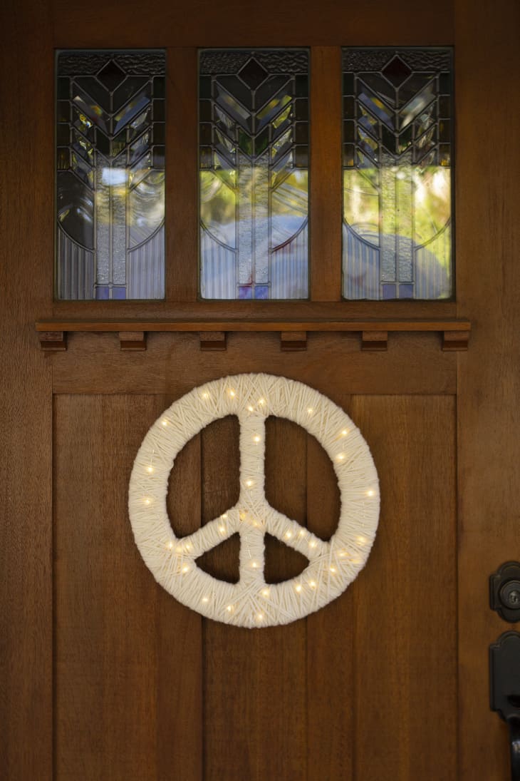 Peace symbol wreath with fairy lights